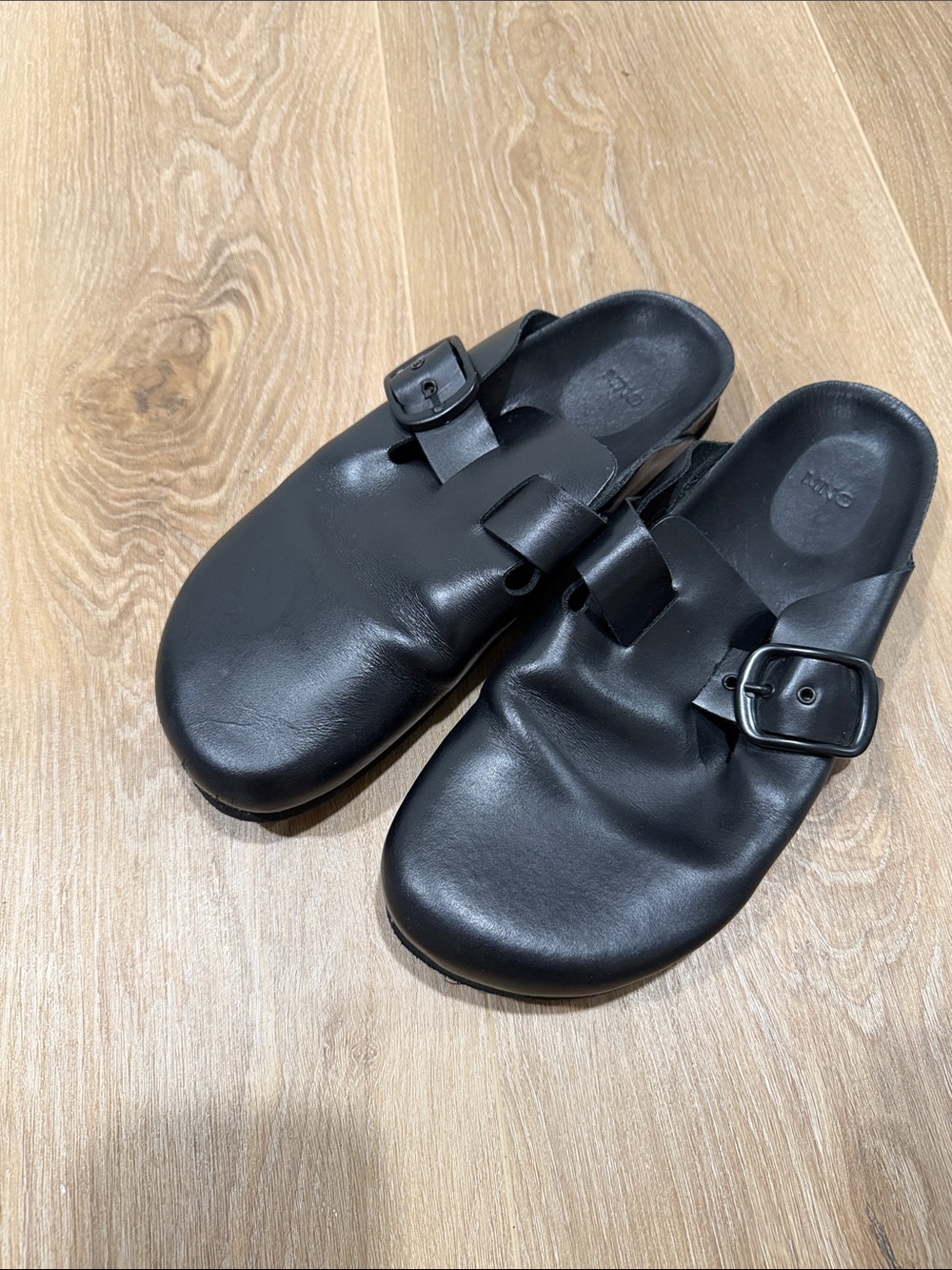 Black Leather Slip-On Buckle Clogs